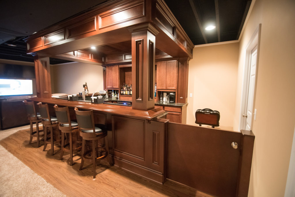 basement bar with soffet and stained wood
