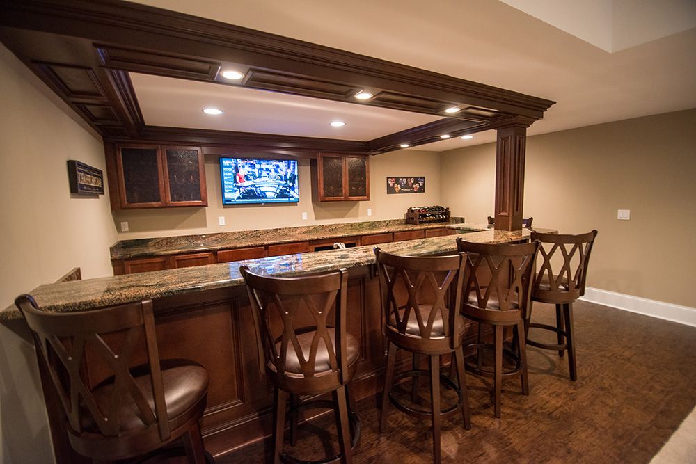 basement bar with posts and soffet work