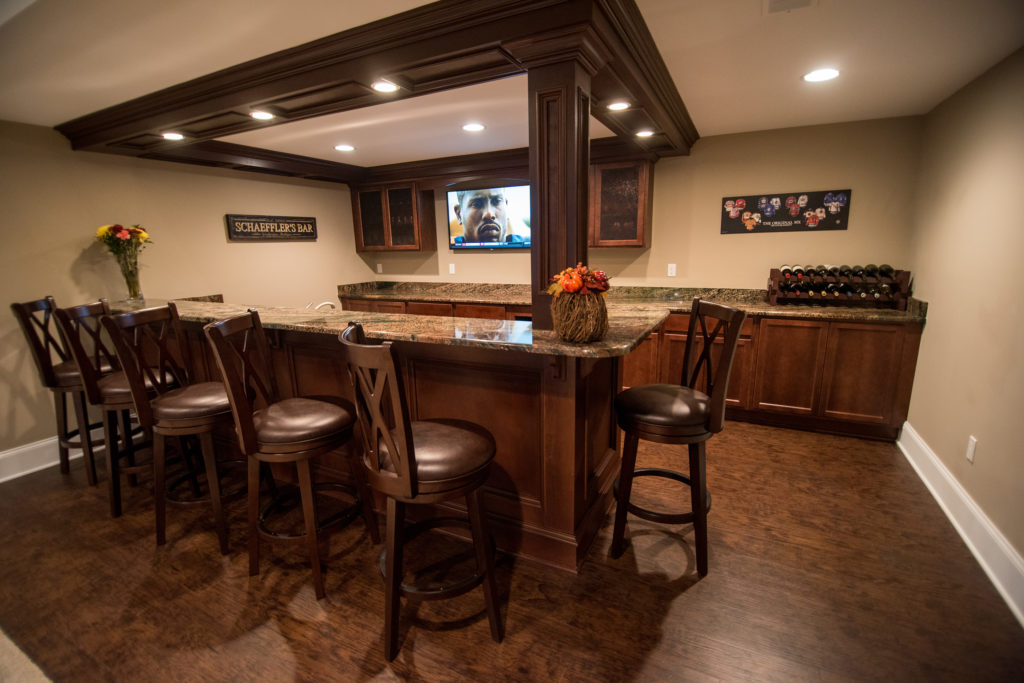 basement with detailed wood working on bar posts and ceiling