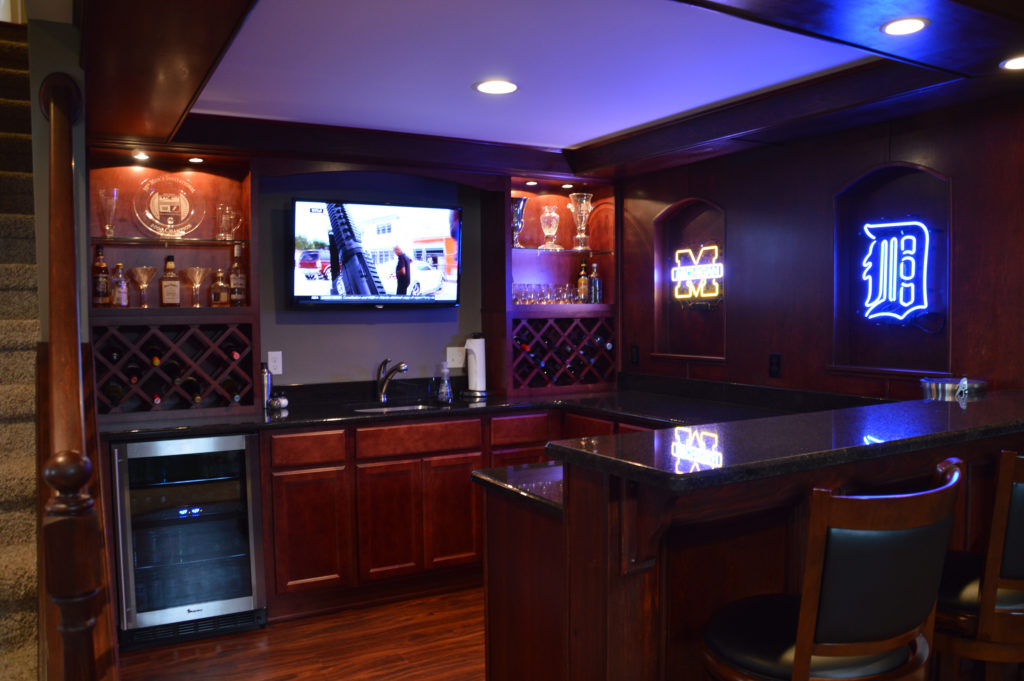 basement sports bar with detroit themed lights and tv