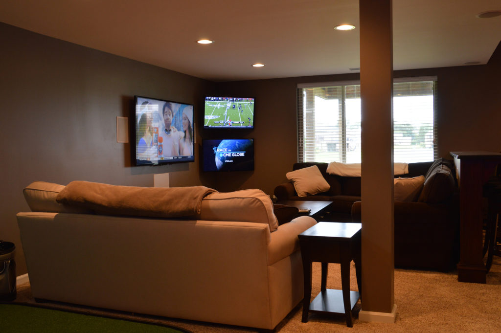 multiple tvs in living room basement