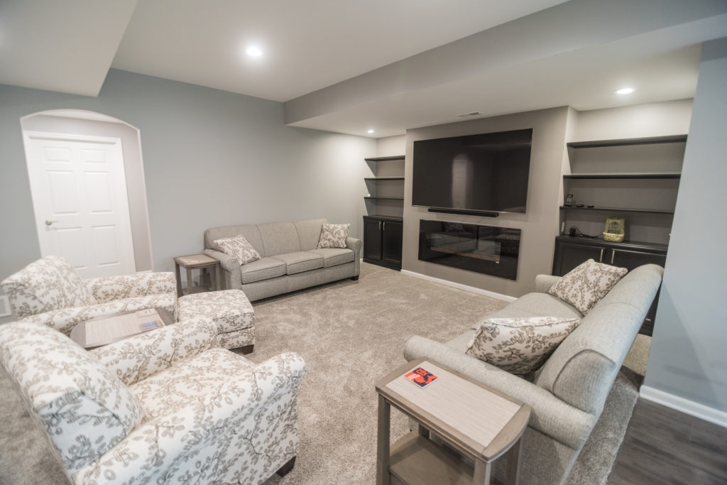brighton michigan finished basement with carpet and grey walls with built in shelving