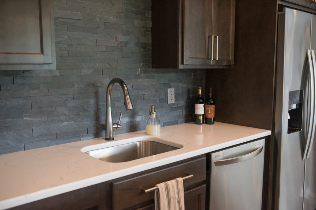 dark tile backsplash in custom bar