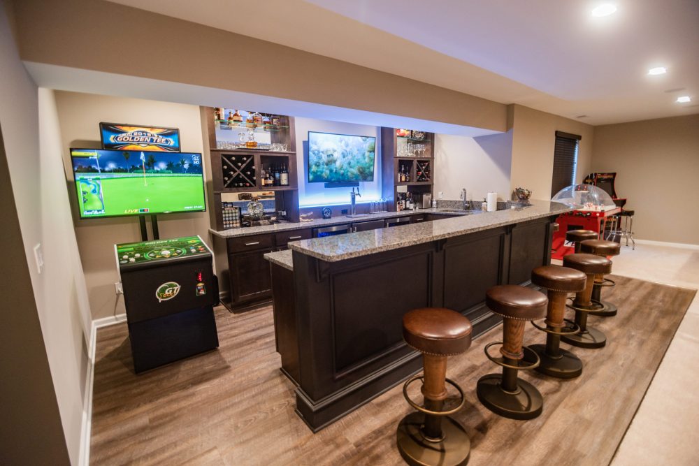 basement bar with entertainment space and seating for guests