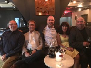 Team members at the caucus club