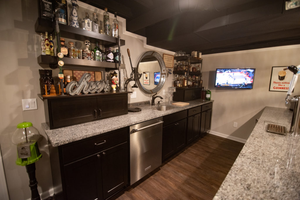 dark cabinetry and granite countertops