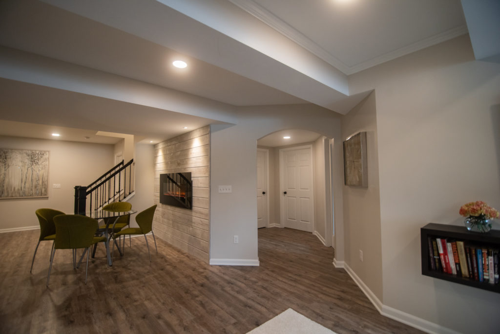 light brown rustic vinyl plank flooring in modern basement