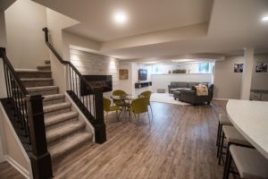 open basement design with fireplace and living room