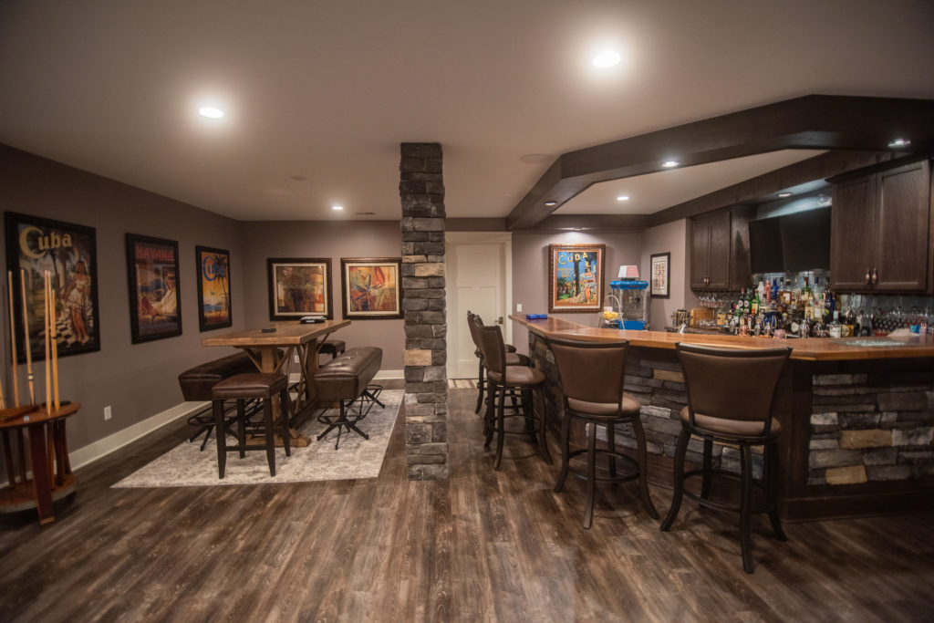finished bar area with stone wrapped support beams