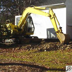 Excavator in a yard
