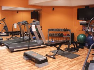 A home gym set up in a remodeled basement.