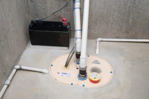 A sump pump installed in a basement.