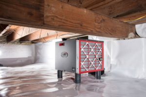 An encapsulated crawlspace with a dehumidifier.