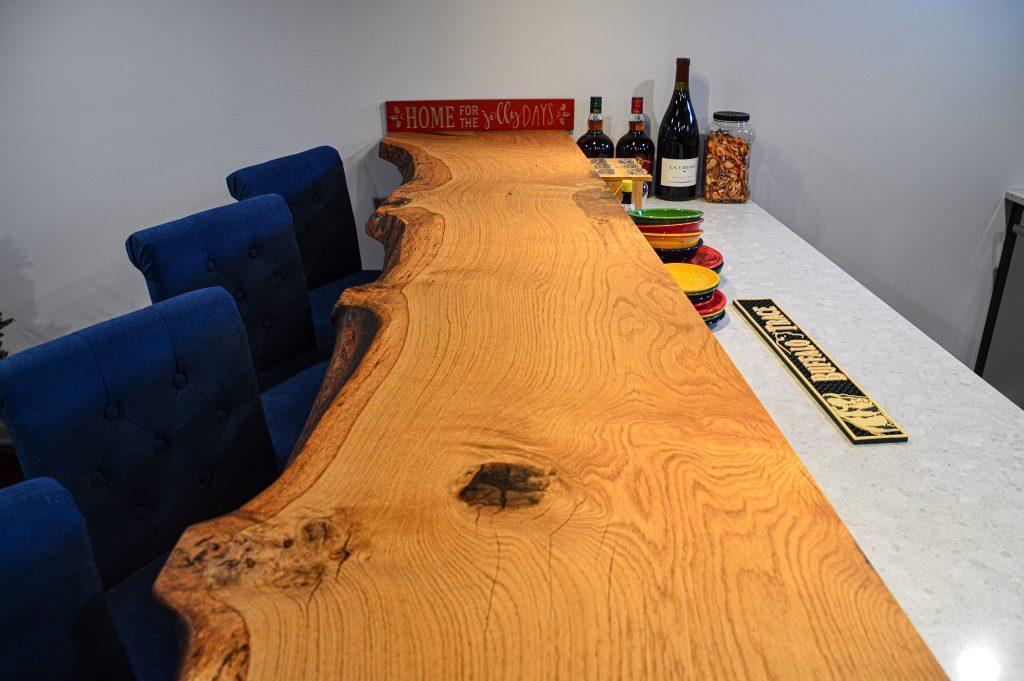 Finished basement home bar with custom wood countertop in Farmington Hills, Michigan