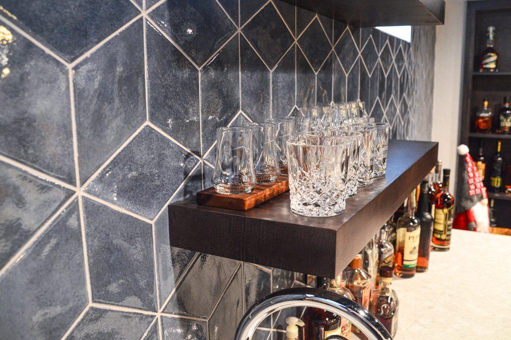 Finished basement home bar with tile backsplash in Farmington Hills, Michigan