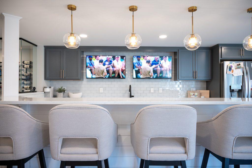 Finished basement bar area with white shiplap and quartz counter in Northville, Michigan
