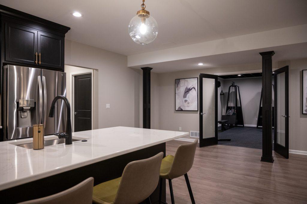 Finished basement bar area and home gym in Northville, Michigan