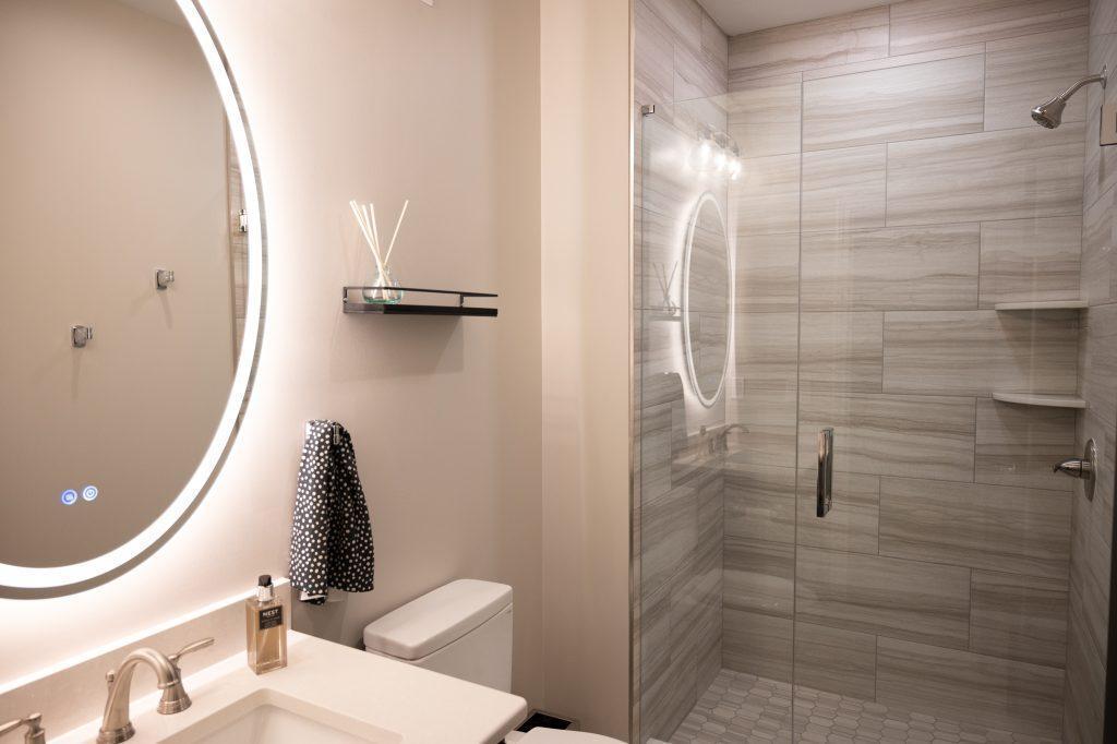 Finished basement bathroom with walk-in shower in Northville, Michigan