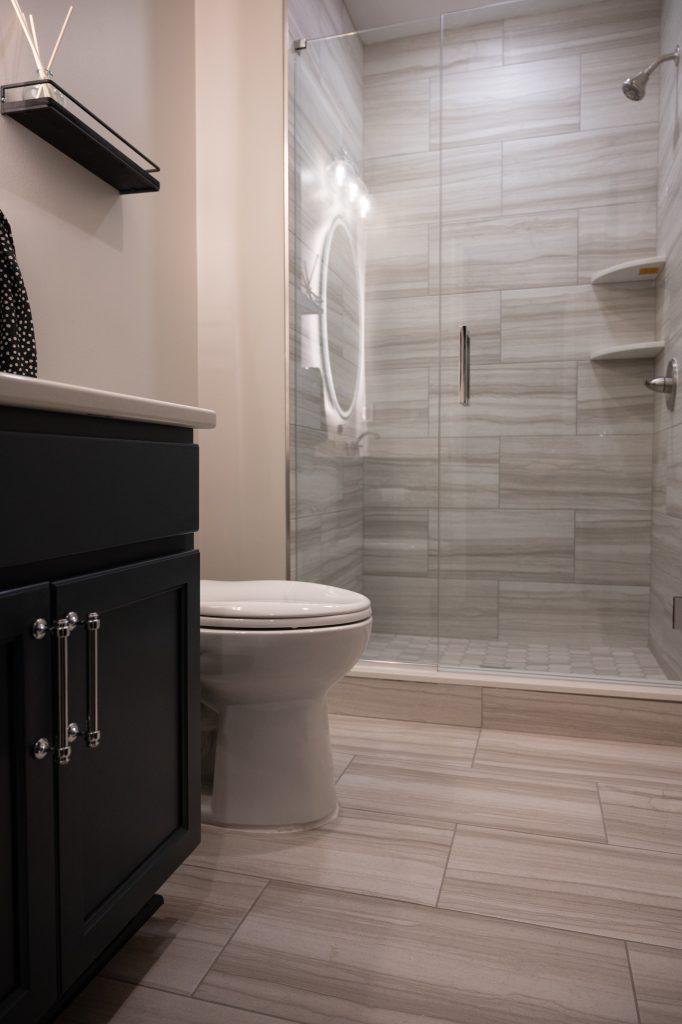 Finished basement bathroom vanity with walk-in shower in Northville, Michigan
