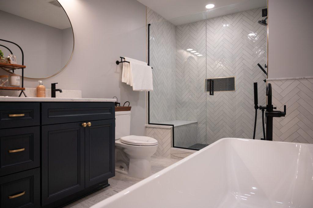 Finished basement bathroom vanity, walk-in shower and large bathtub in Bloomfield Hills, Michigan