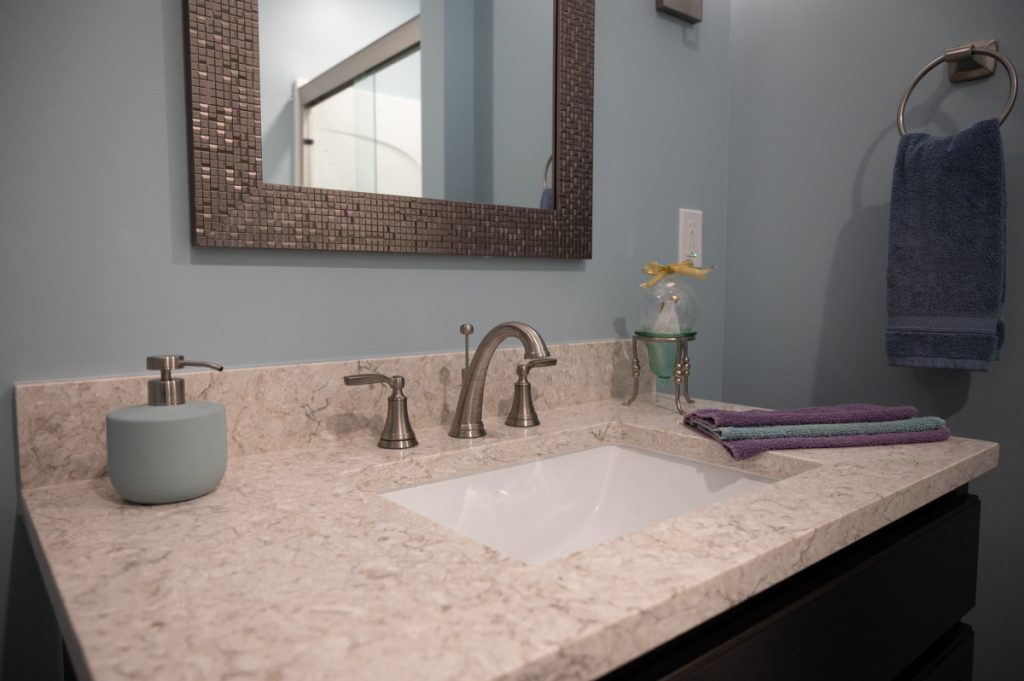 Finished basement bathroom vanity sink in Romeo, Michigan