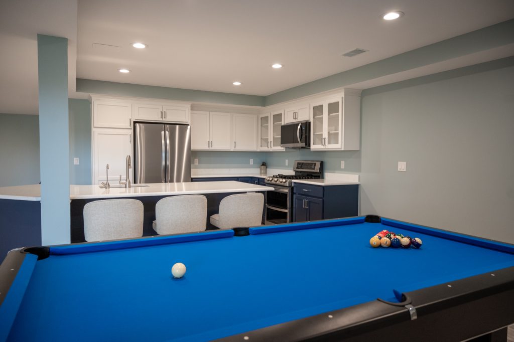 Finished basement kitchen and game area in White Lake, Michigan