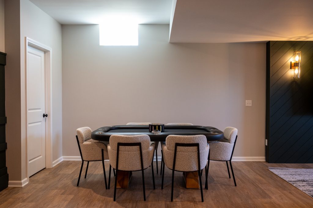 Poker table in Finished game room of Oakland Township basement