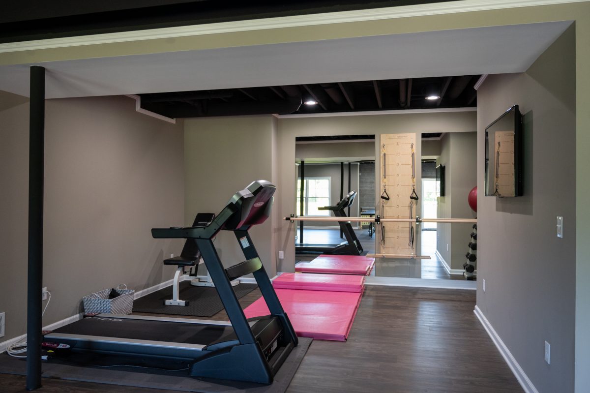 Finished Basement with Bar, Home Gym and Bathroom in Northville, MI - Basements Plus