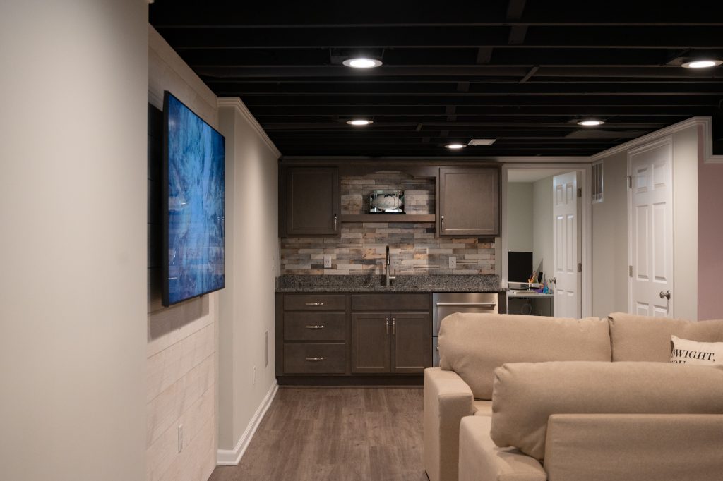 Wet bar in renovated basement by Basements Plus