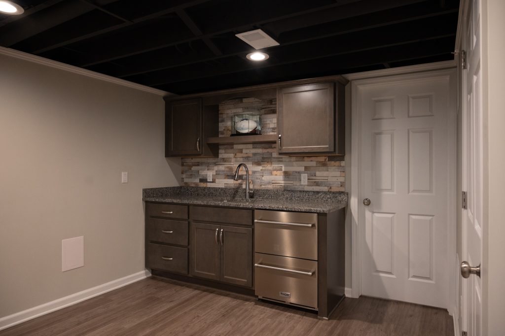 Wet bar in renovated basement by Basements Plus