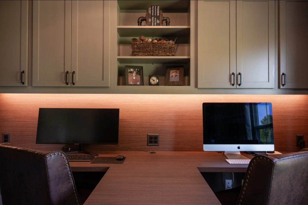 Elegant home office with dual monitors and custom cabinetry highlighting quality remodeling work